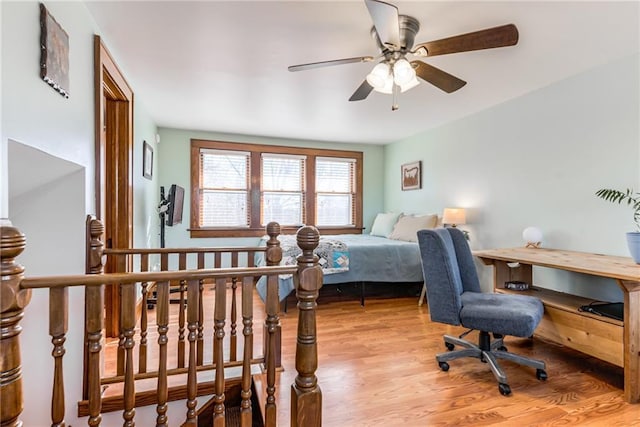 bedroom with ceiling fan and light hardwood / wood-style floors