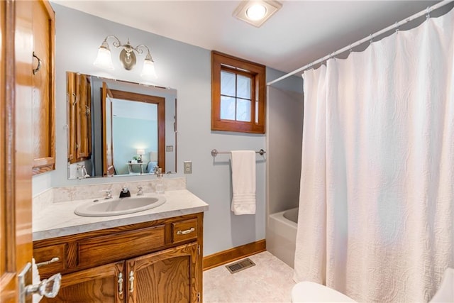 bathroom with vanity and shower / tub combo