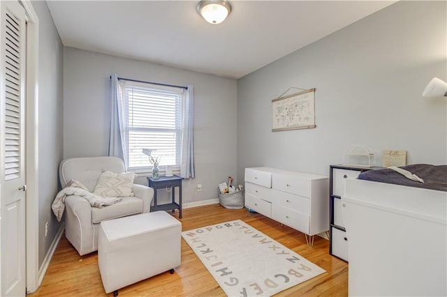 sitting room featuring light hardwood / wood-style floors