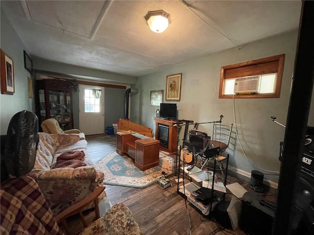 interior space featuring cooling unit and wood-type flooring