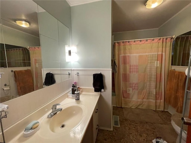 bathroom featuring vanity, curtained shower, and ornamental molding