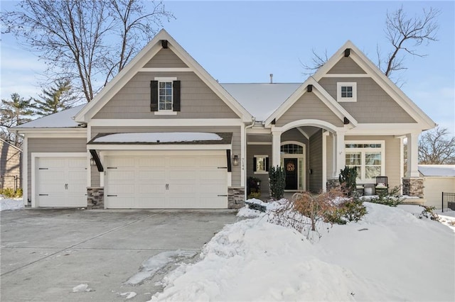 craftsman-style house with covered porch and a garage