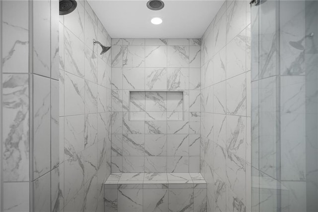 bathroom with tiled shower