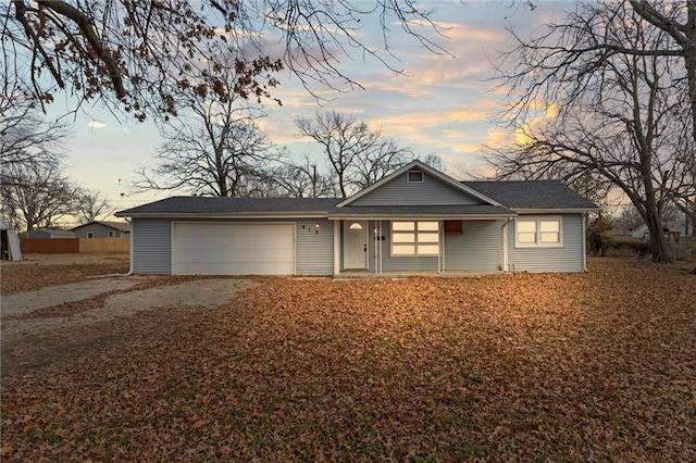 ranch-style house featuring a garage