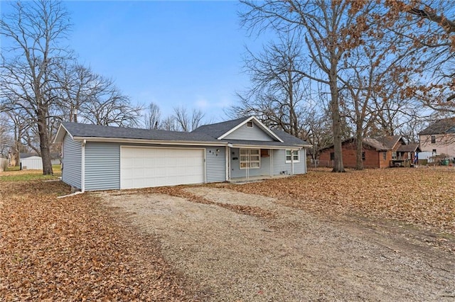 ranch-style home featuring a garage