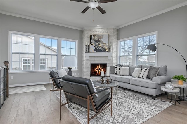 living room with ornamental molding and light hardwood / wood-style floors