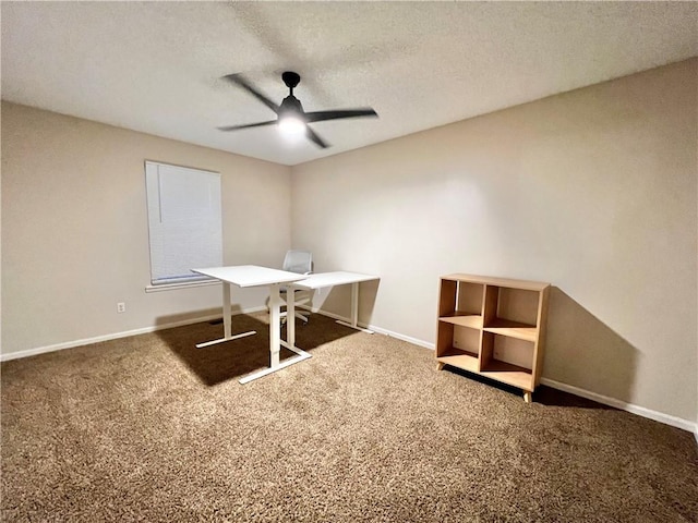 unfurnished office with dark colored carpet, a textured ceiling, and ceiling fan