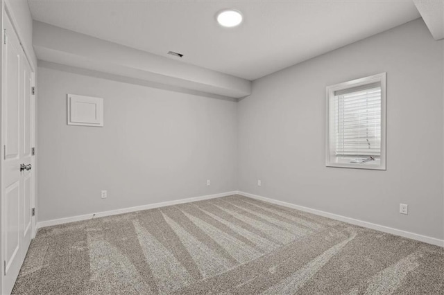 unfurnished room featuring carpet