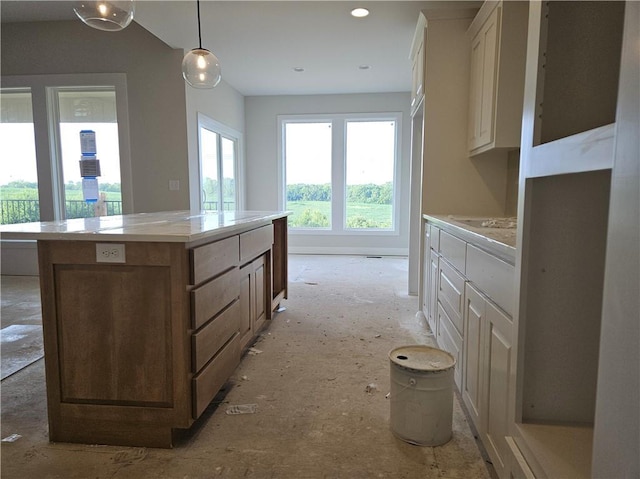 5005 146th St, Basehor, KS 66007 - kitchen featuring a center island, light countertops, hanging light fixtures, recessed lighting, and white cabinets