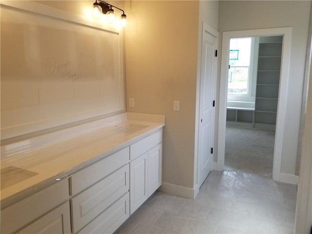 5005 146th St, Basehor, KS 66007 - bathroom featuring vanity and tile patterned floors