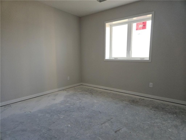 5005 146th St, Basehor, KS 66007 - empty room featuring concrete flooring and baseboards