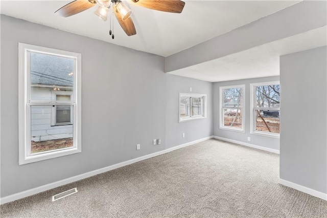 carpeted empty room with ceiling fan