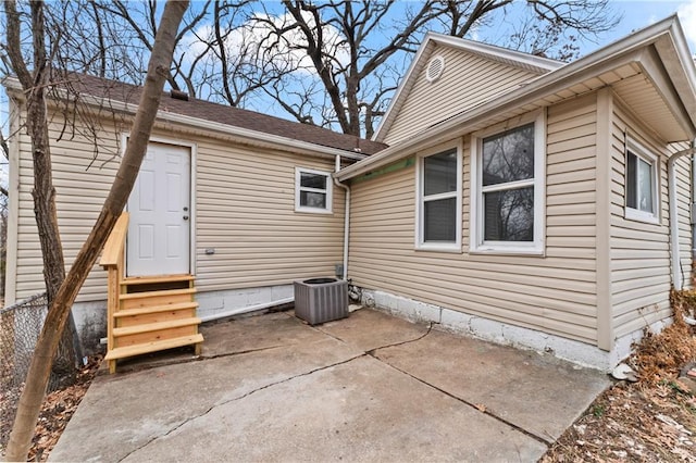 exterior space with cooling unit and a patio