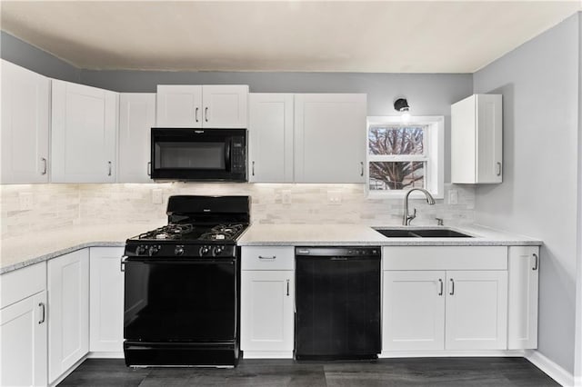 kitchen featuring sink, black appliances, dark hardwood / wood-style floors, decorative backsplash, and white cabinets