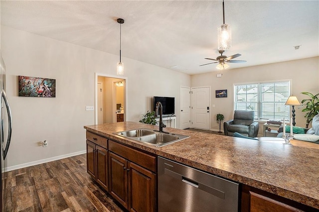 kitchen featuring ceiling fan, dishwasher, sink, hanging light fixtures, and dark hardwood / wood-style flooring