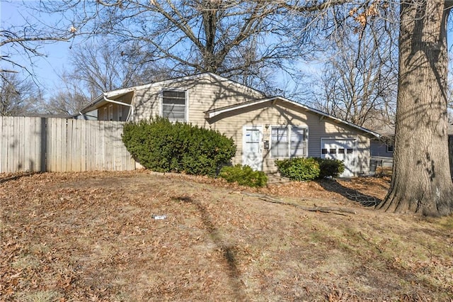 view of side of home with a garage