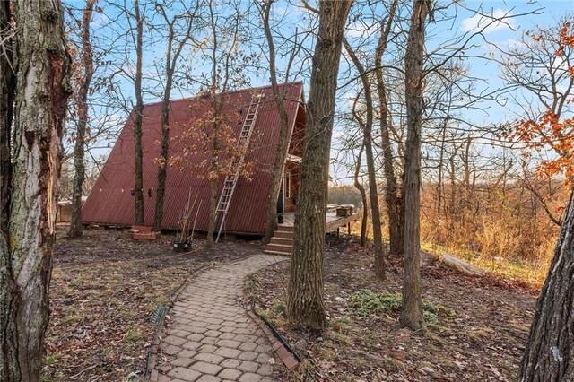 view of property exterior featuring an outdoor structure