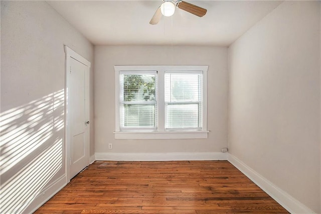 empty room featuring hardwood / wood-style floors and ceiling fan