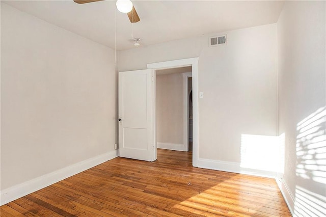 spare room with ceiling fan and hardwood / wood-style floors