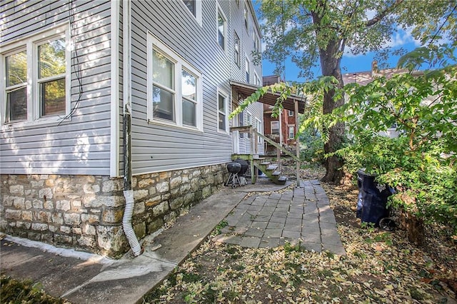 view of property exterior featuring a patio area