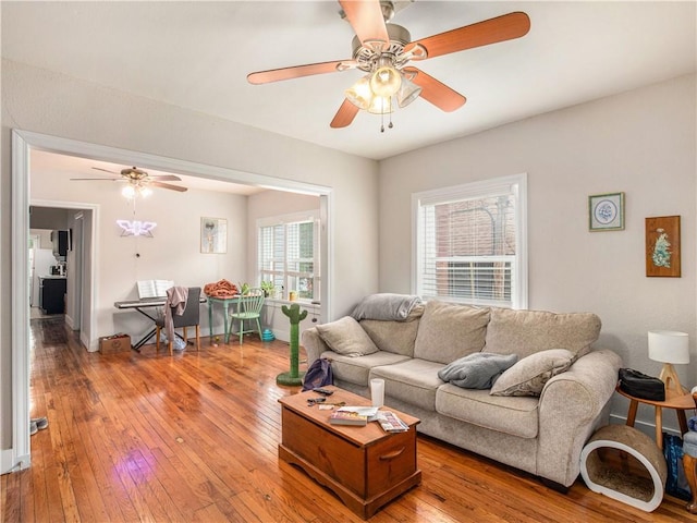 living room featuring hardwood / wood-style flooring and ceiling fan