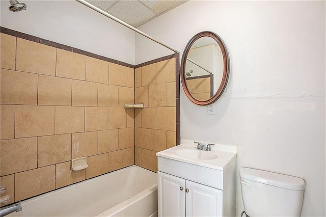 full bathroom featuring vanity, toilet, and tiled shower / bath