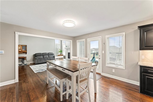 dining area featuring dark hardwood / wood-style floors