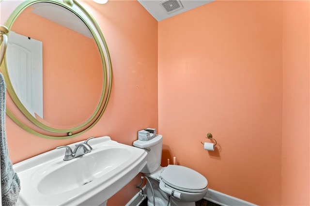 bathroom featuring sink and toilet