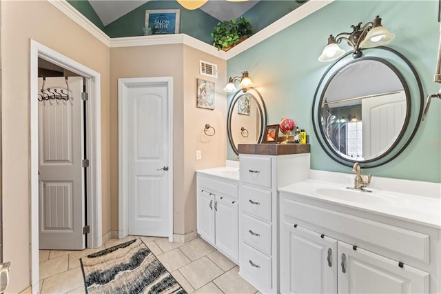 bathroom with tile patterned floors, vanity, and lofted ceiling