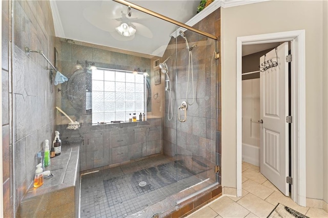 bathroom with tile patterned floors and walk in shower