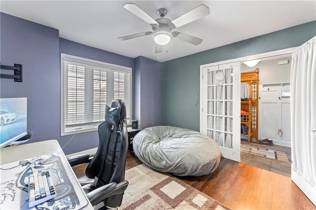 office area with hardwood / wood-style floors, french doors, and ceiling fan