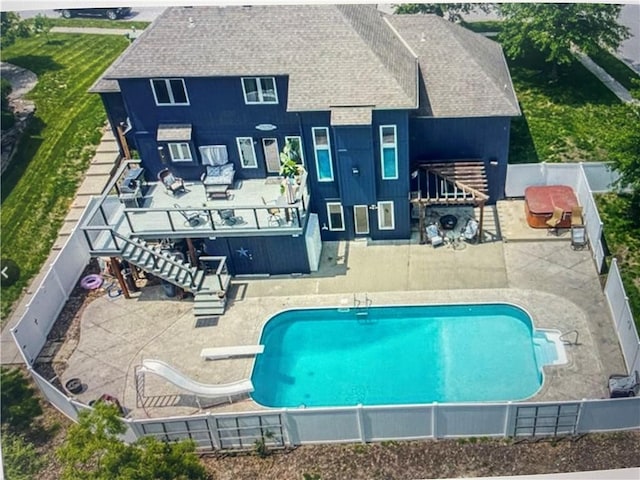 exterior space featuring a pergola, a diving board, and a patio