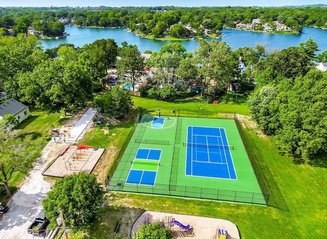 bird's eye view with a water view and a forest view