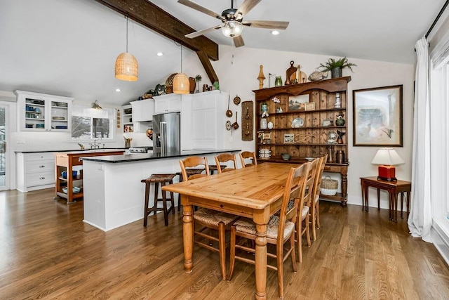 dining room with ceiling fan, recessed lighting, dark wood finished floors, and vaulted ceiling with beams