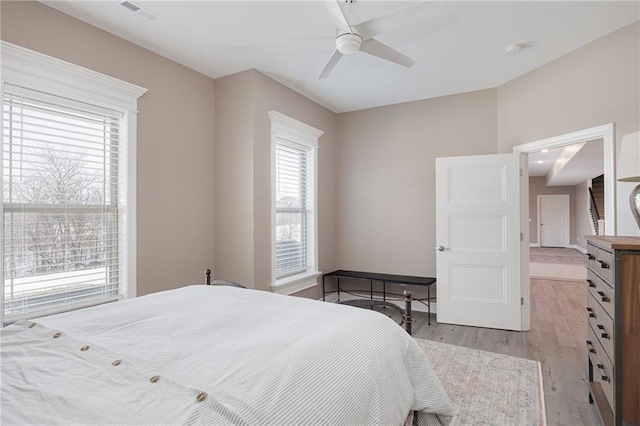 bedroom featuring light wood-type flooring and ceiling fan