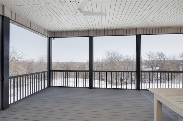 unfurnished sunroom with plenty of natural light and ceiling fan