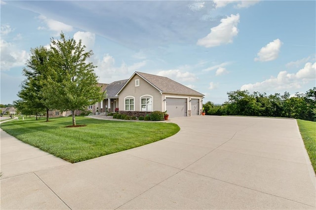 view of front of home featuring a garage and a front yard