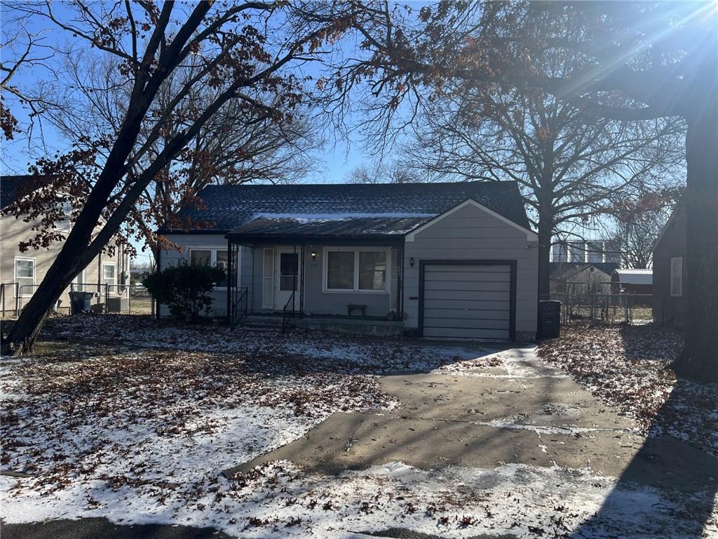 single story home with a garage