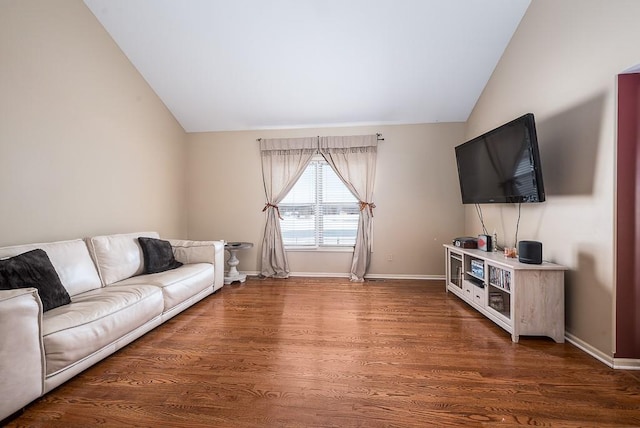 living room featuring dark hardwood / wood-style floors and lofted ceiling