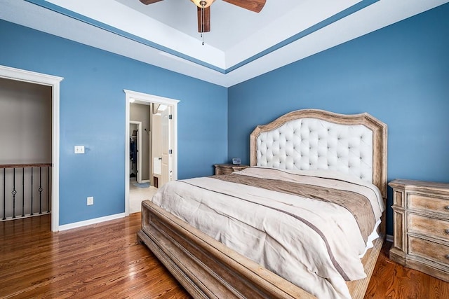 bedroom featuring ceiling fan and dark hardwood / wood-style flooring