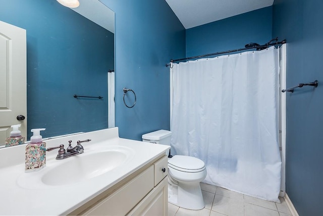 bathroom featuring tile patterned floors, toilet, and vanity