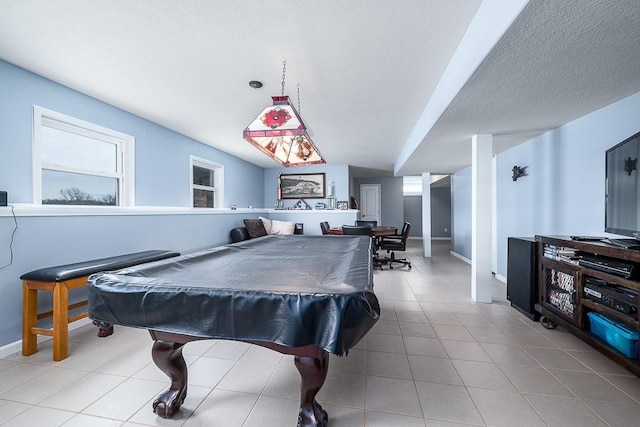 game room with a textured ceiling and billiards