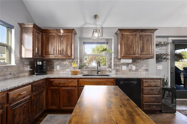 kitchen with dishwasher, wood counters, a wealth of natural light, and sink