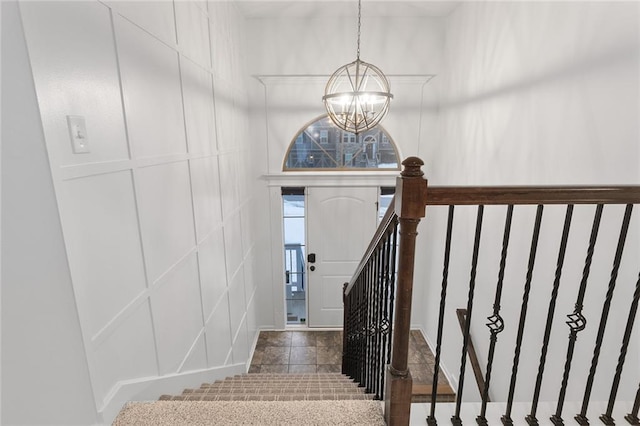 foyer entrance featuring a chandelier