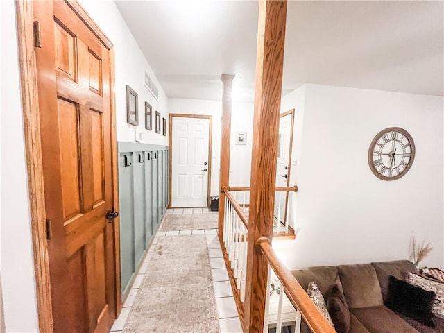 corridor with light tile patterned floors