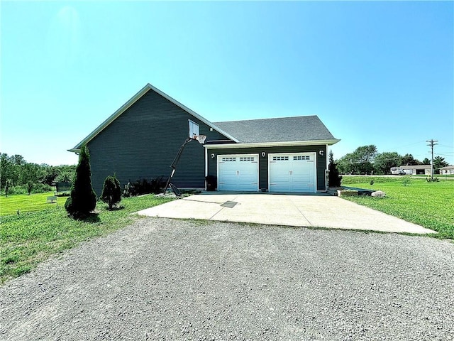 view of property exterior featuring a garage and a yard