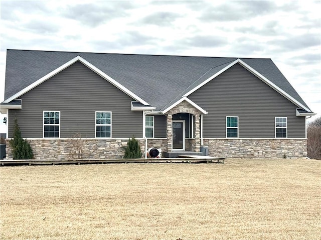 craftsman-style home with a front yard