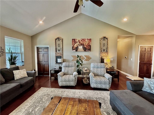 living room featuring ceiling fan, lofted ceiling, and dark hardwood / wood-style flooring