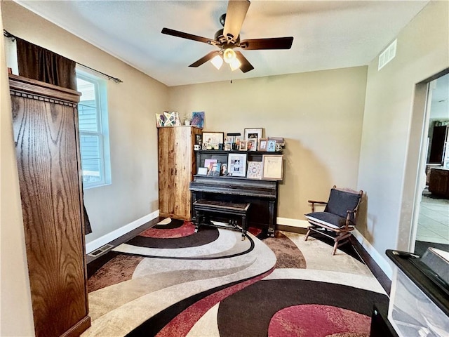 living area featuring ceiling fan