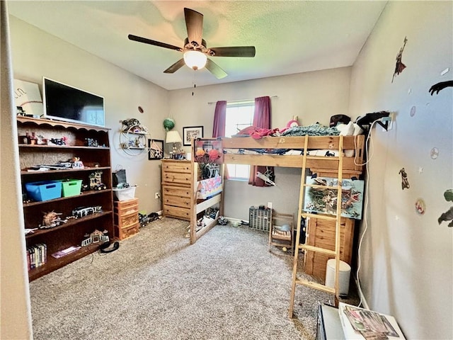 bedroom featuring ceiling fan and carpet flooring